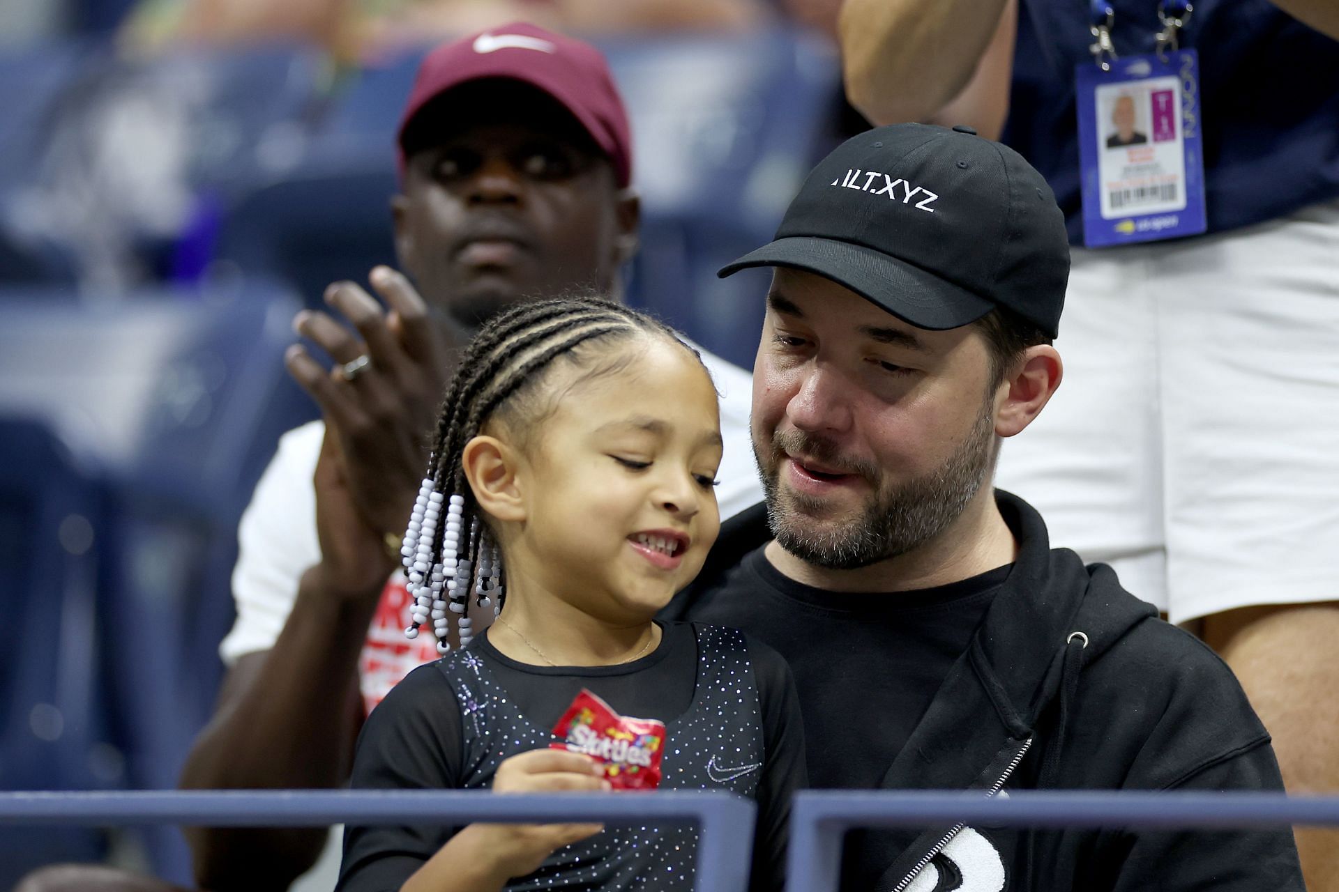 Alexis Ohanian and his daughter Olympia watching Serena Williams' first-round match at the US Open
